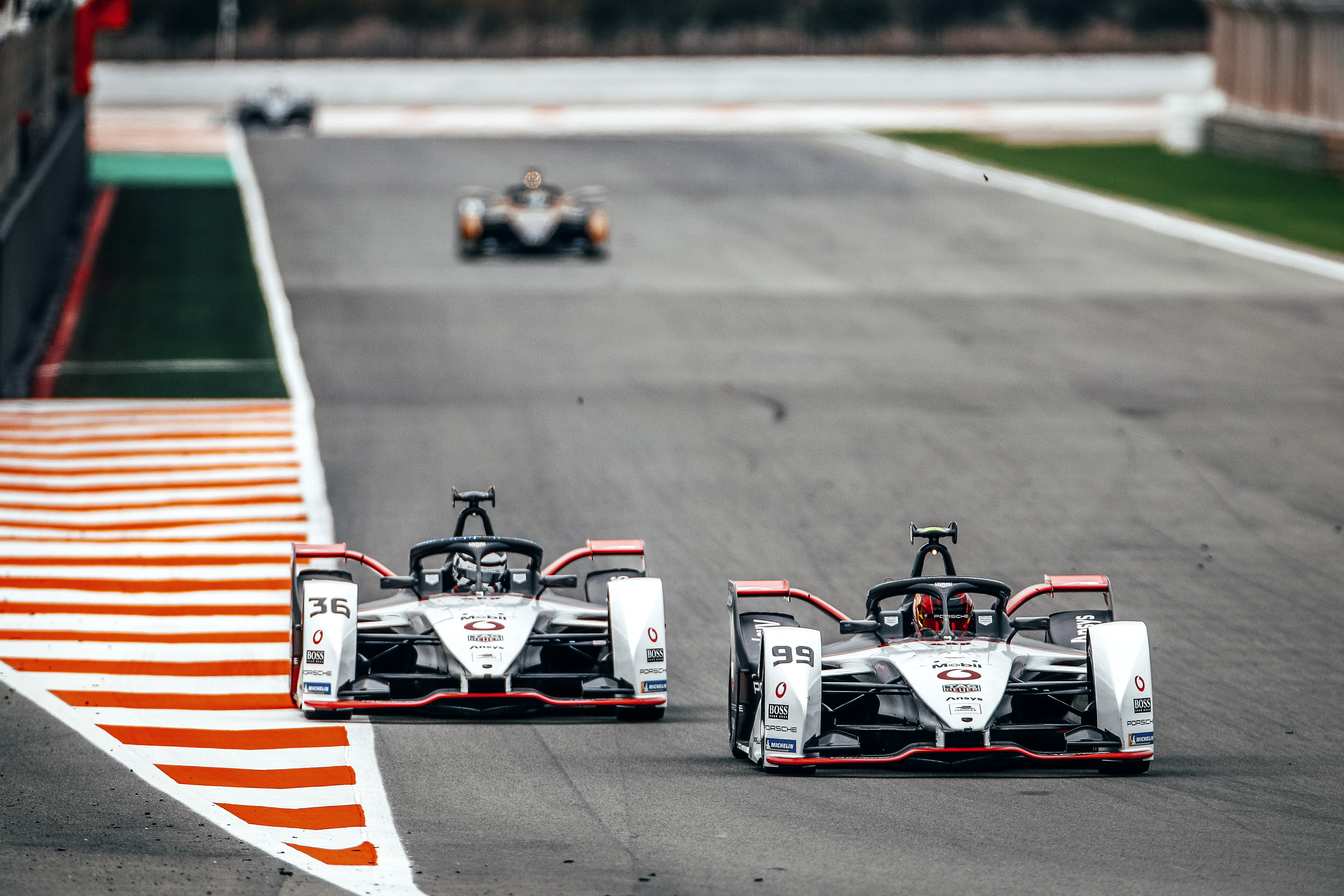 Two TAG Heuer Porsche Formula E cars side by side
