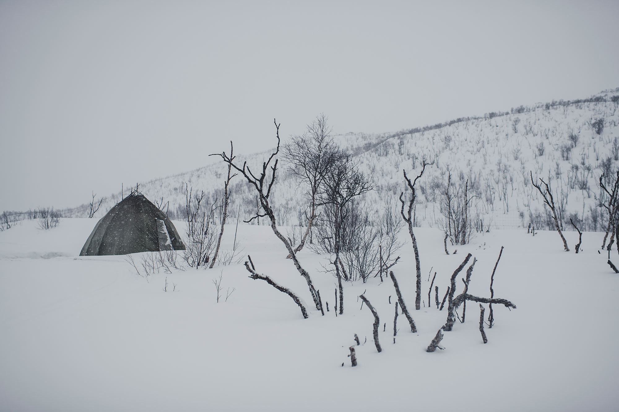 Outside of the lavvu in snowy landscape