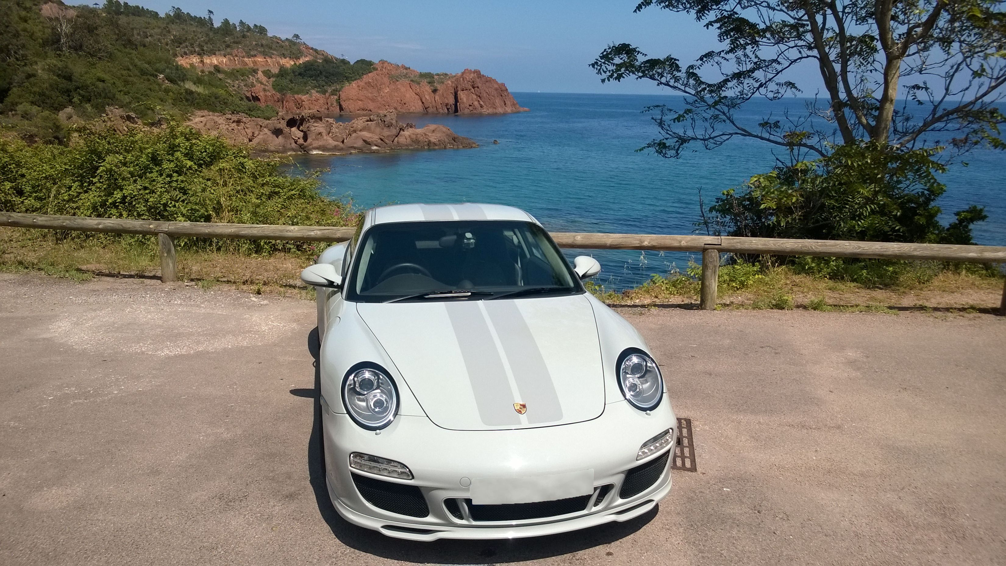 Grey 2009 Porsche 911 Sport Classic by rocky Mediterranean coastline