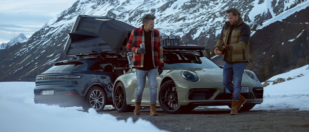 Men with Porsche cars featuring Porsche winter camping equipment