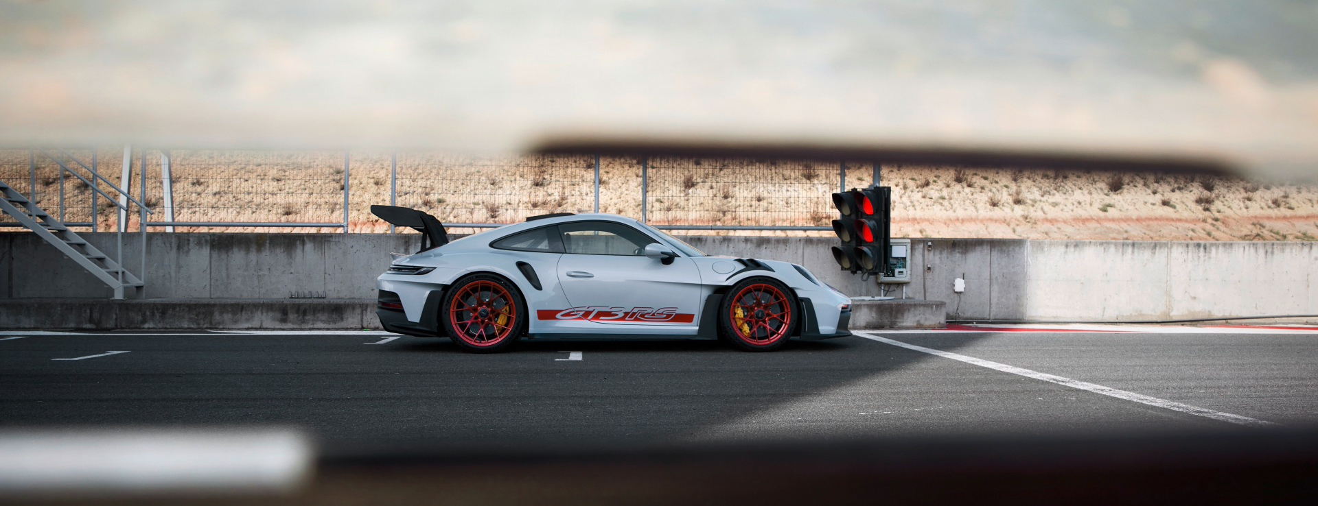 Side view of Porsche 911 GT3 RS on starting grid