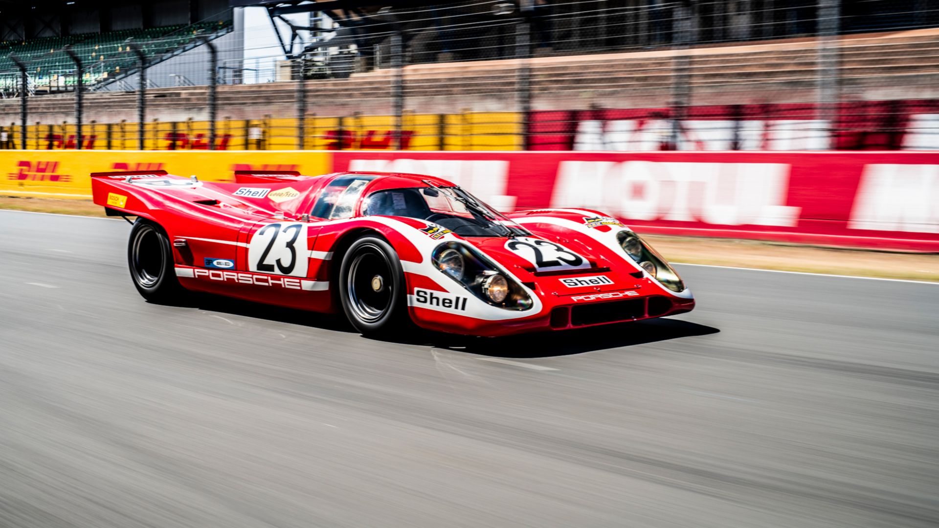 White and red Salzburger liveried Porsche 917 KH on racetrack