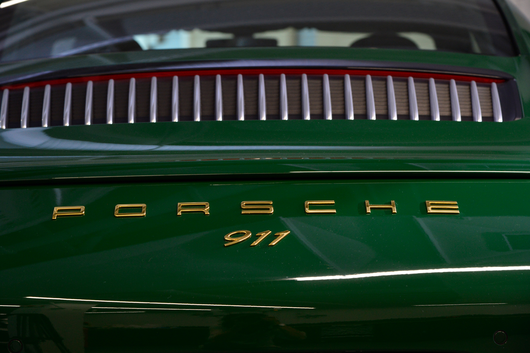 Close-up rear view of emerald green Porsche 911