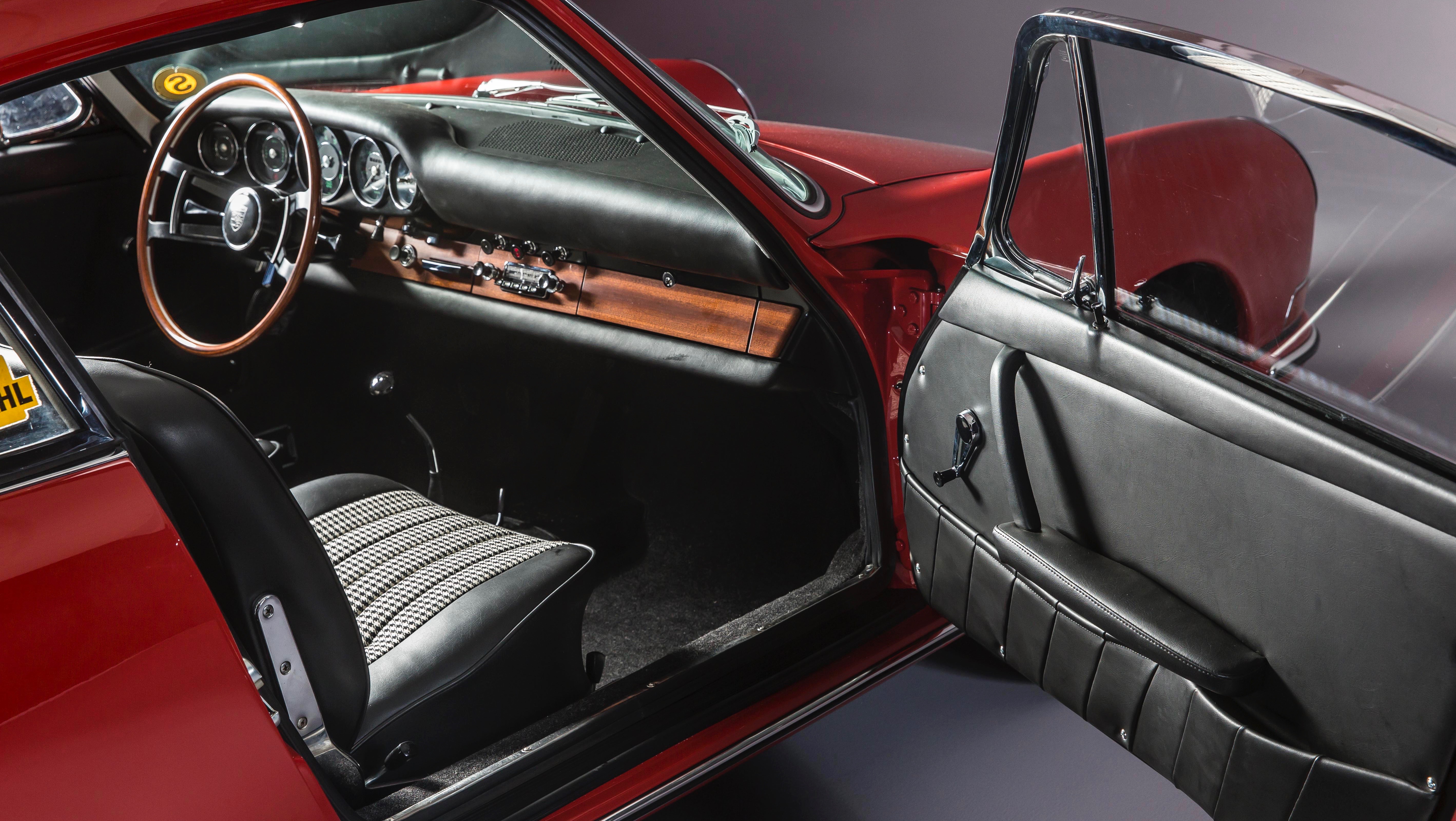 Interior of classic Porsche 911 featuring seats in Pepita cloth