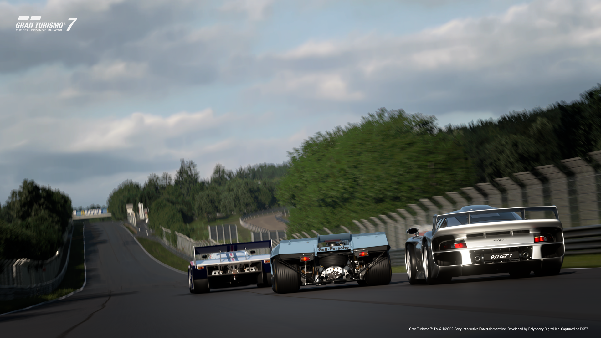 Rear view of 962 C, 917K and 911 GT1 on track