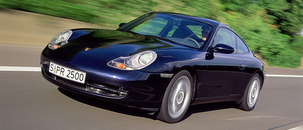 Dark blue Porsche 911 (996) on road