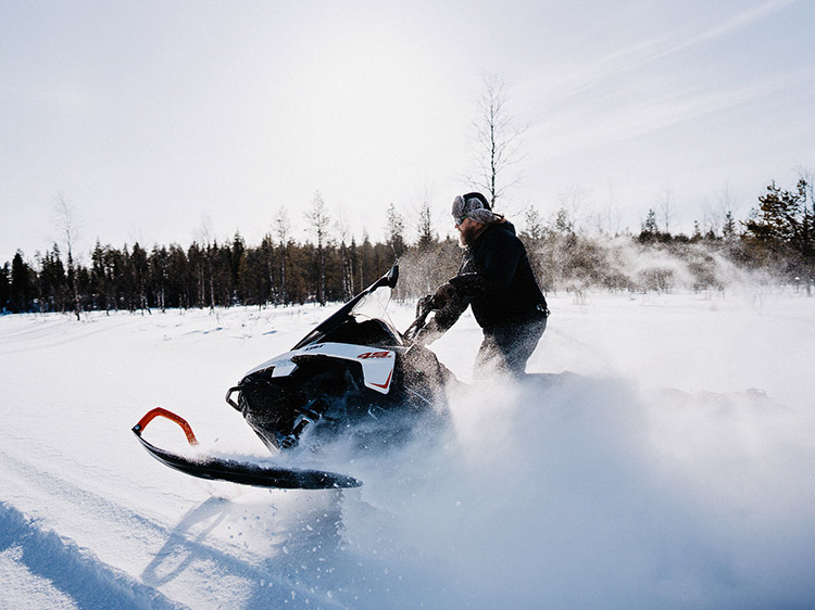 A man on a snowmobile in Finland