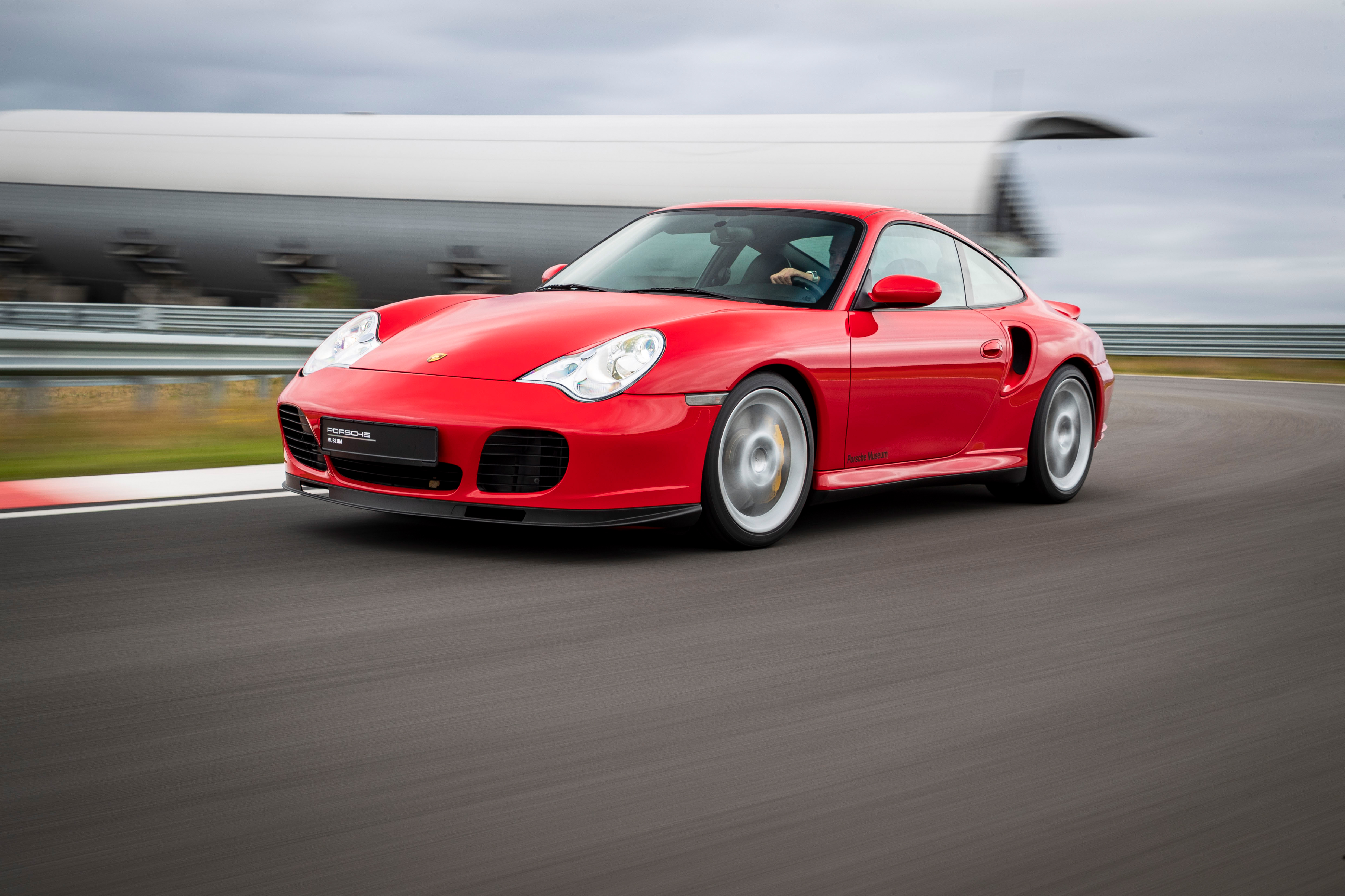 Front view of red Porsche 911 Turbo on racetrack