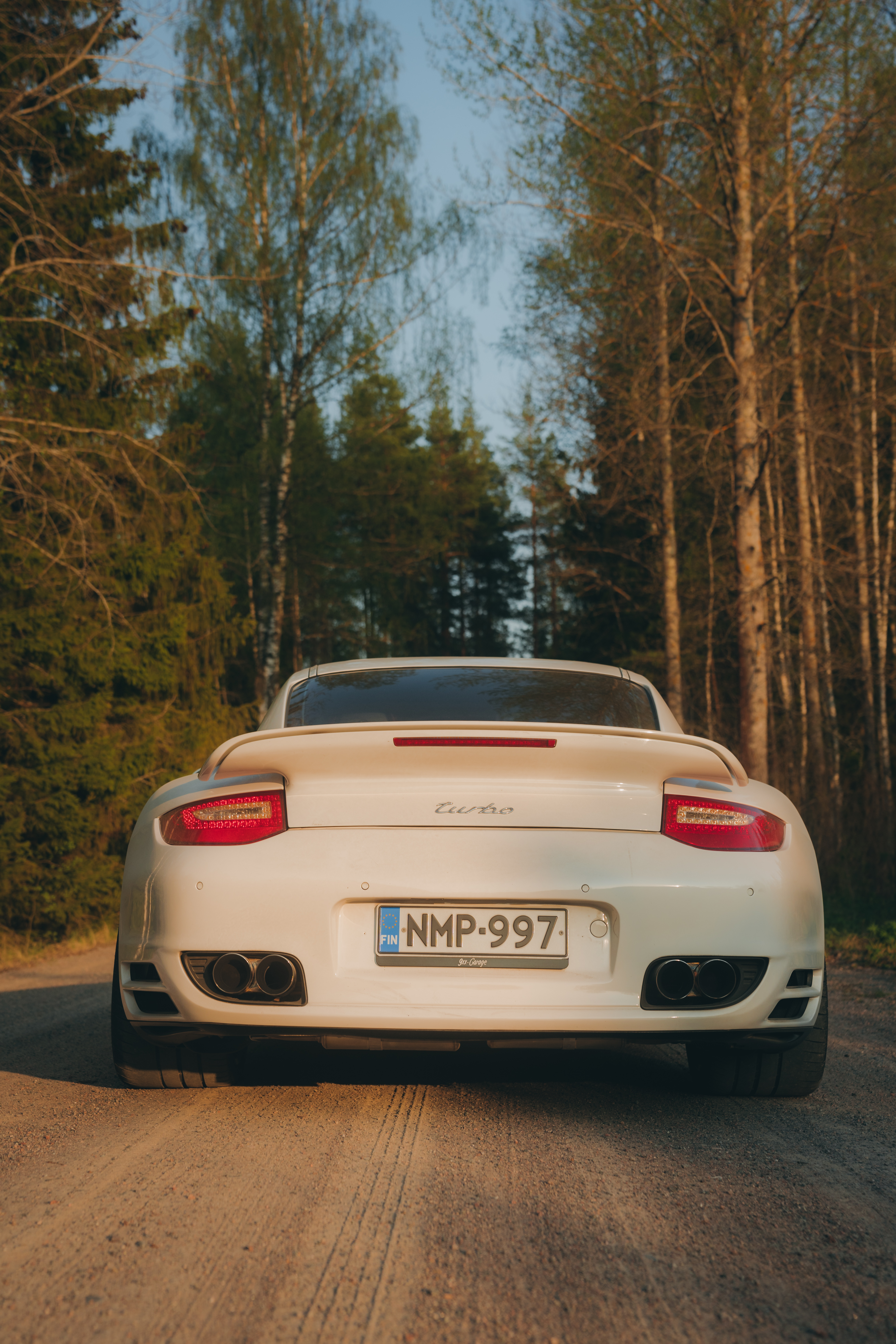 White Porsche 911 Turbo (type 997) in a Finnish forest