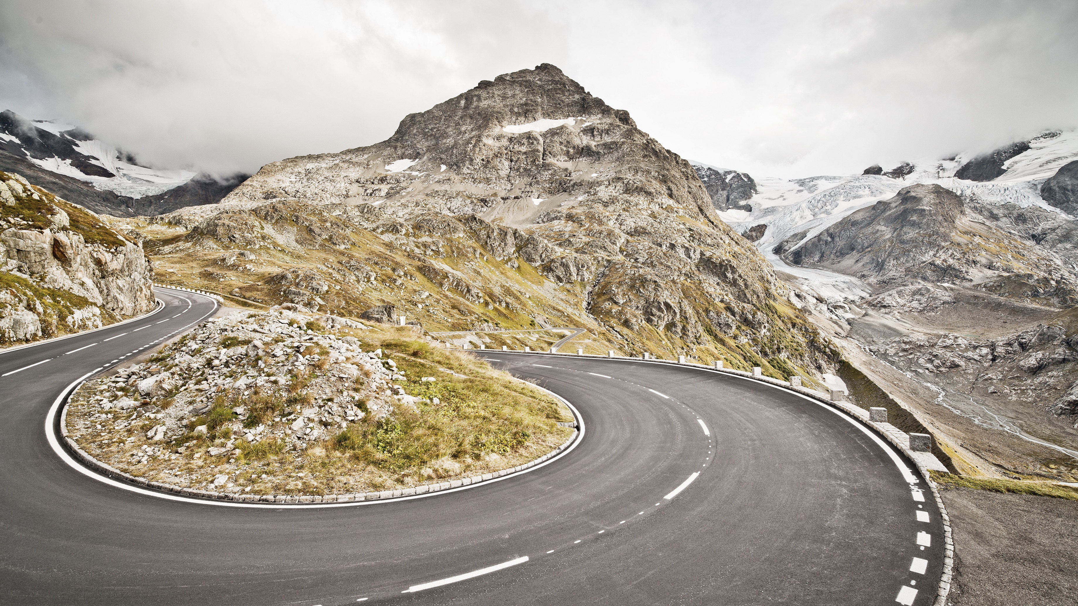 Empty, curvy road in the Swiss Alps