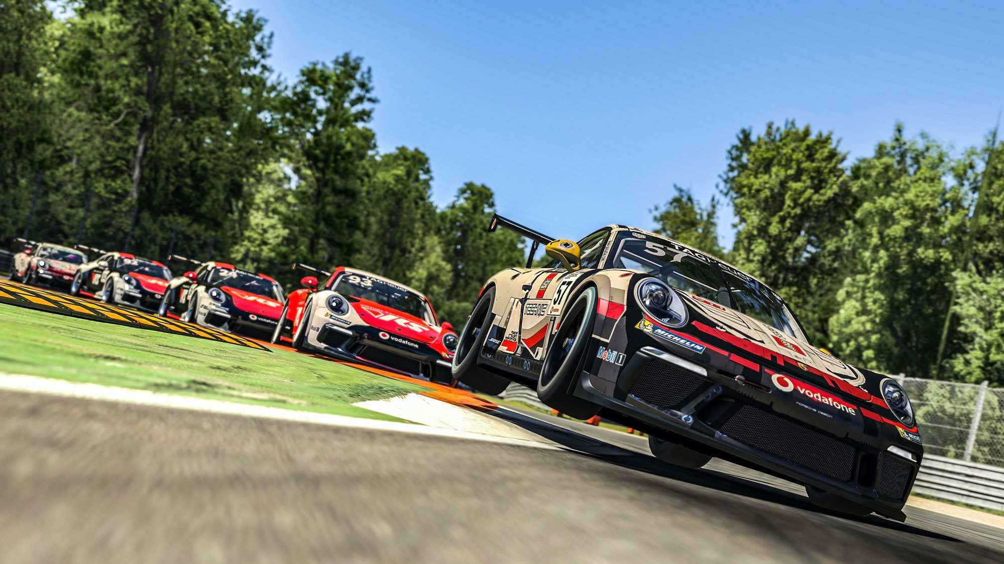 Porsche 911 racecars on track in an Esports race