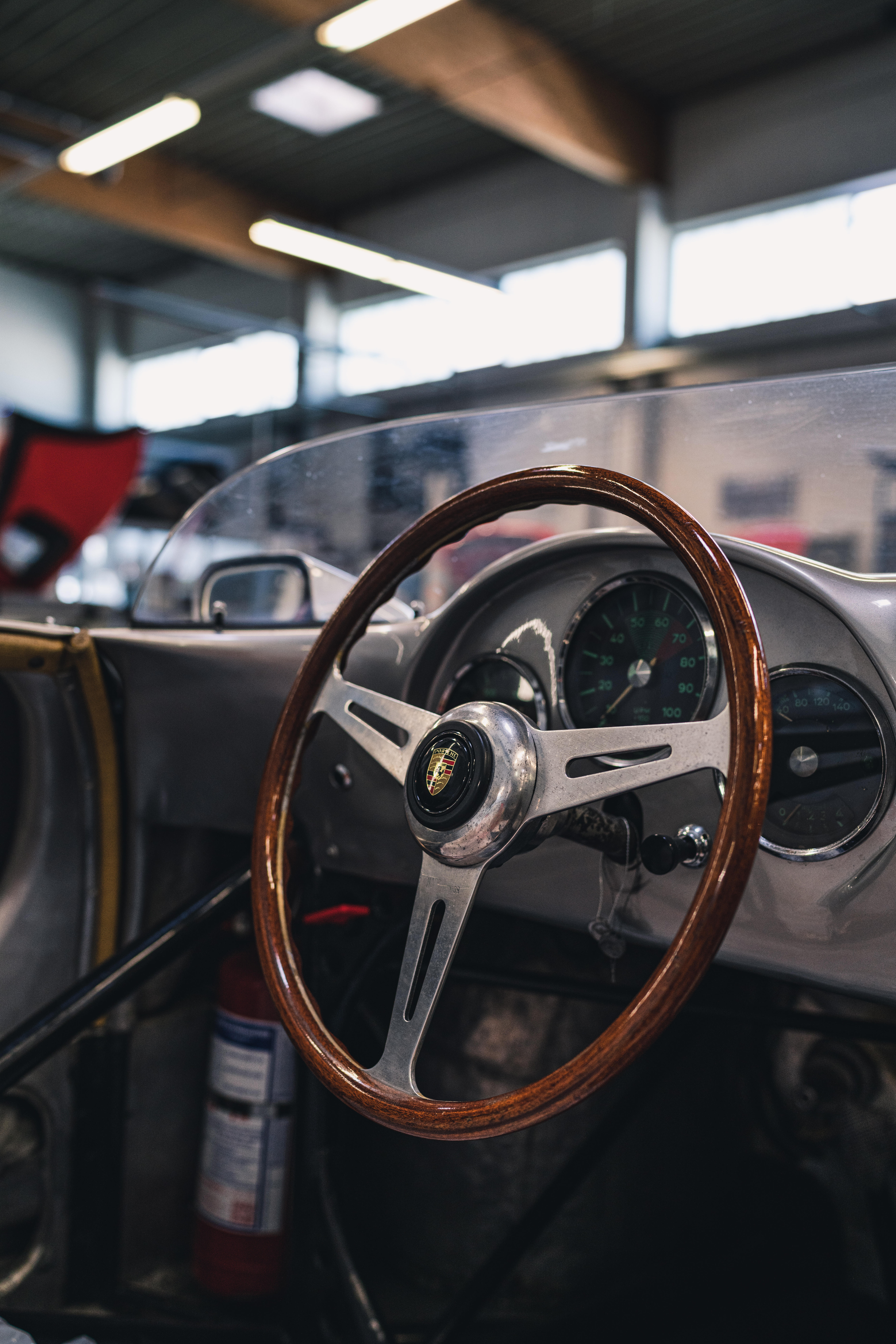 Wooden steering wheel of a Porsche 356 that’s undergoing restoration