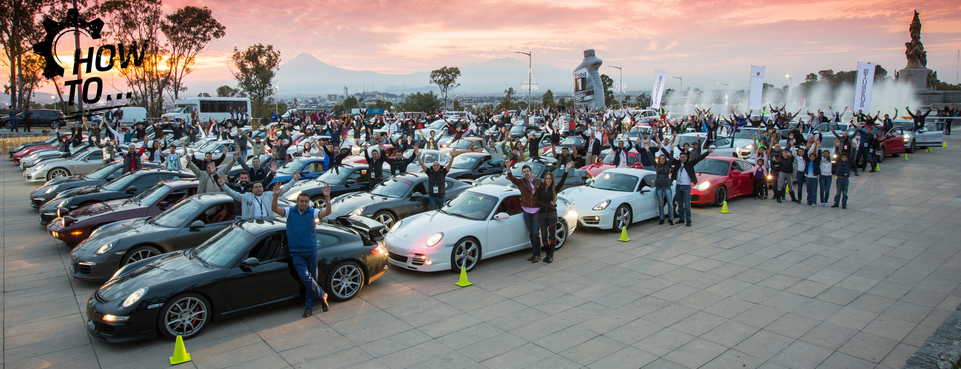 Many Porsche Club Mexico members and their cars waving