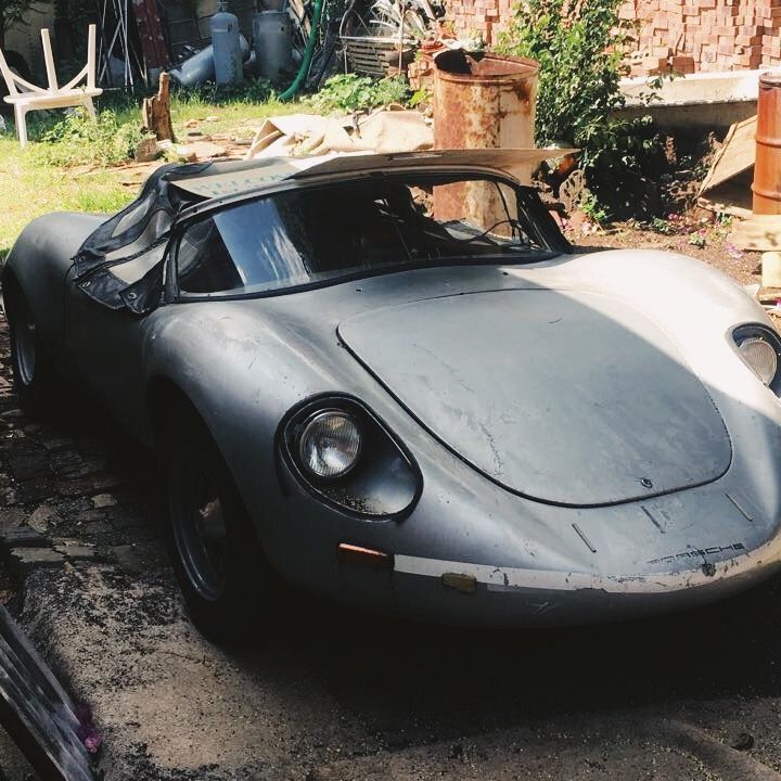 The rusted, old-timer Porsche 718 replica in silver