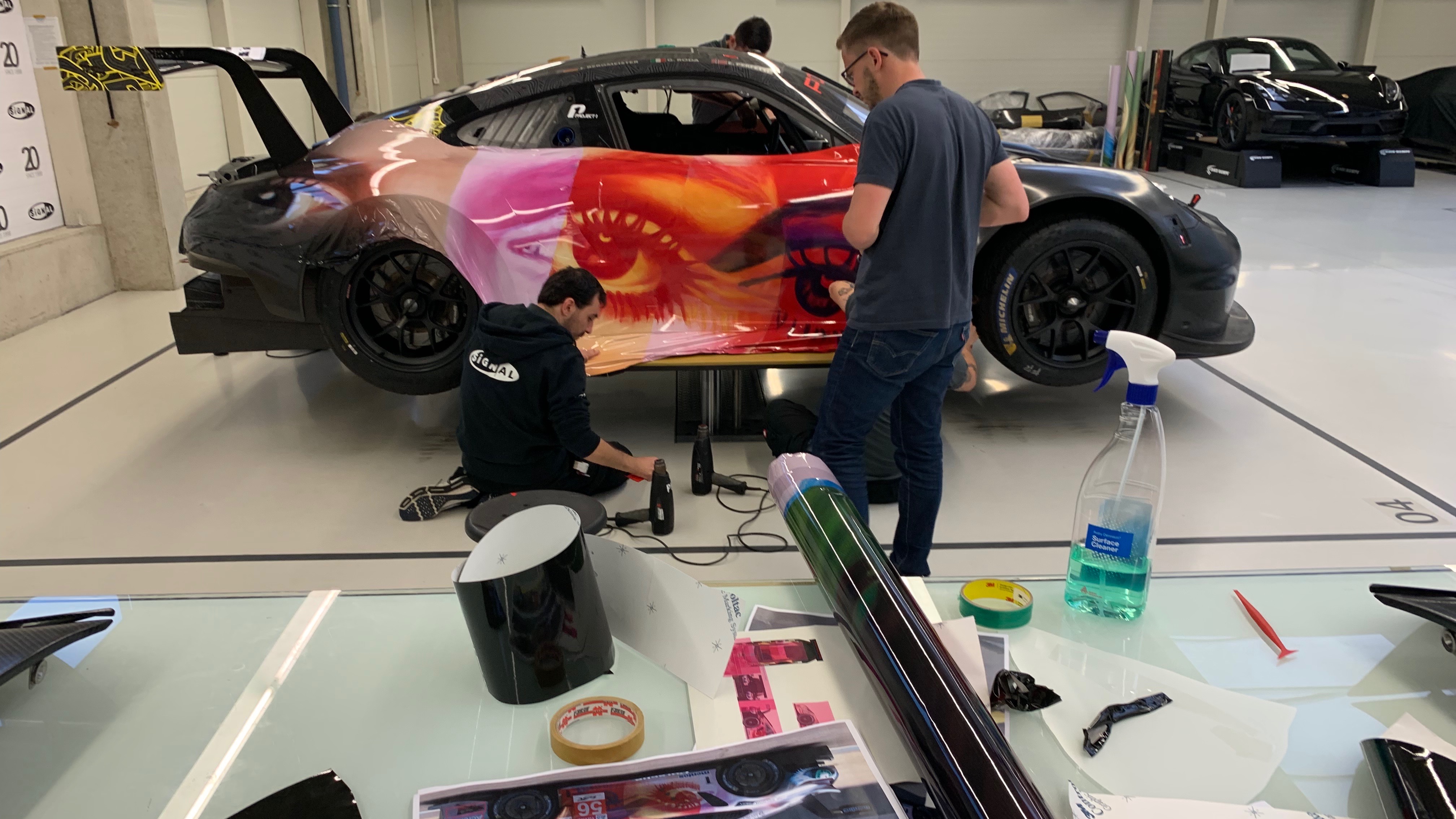 911 RSR Richard Phillips art car having its wrap fitted