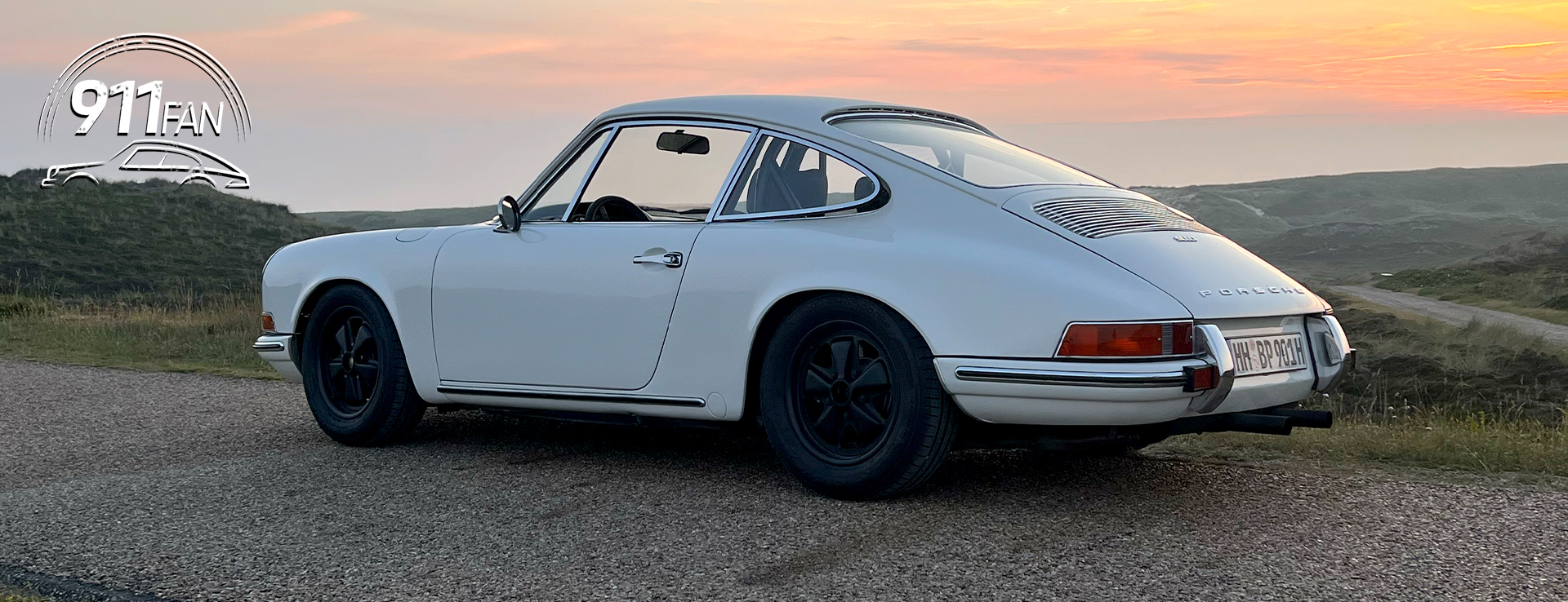 White 1969 Porsche 911T parked up, sunset sky behind