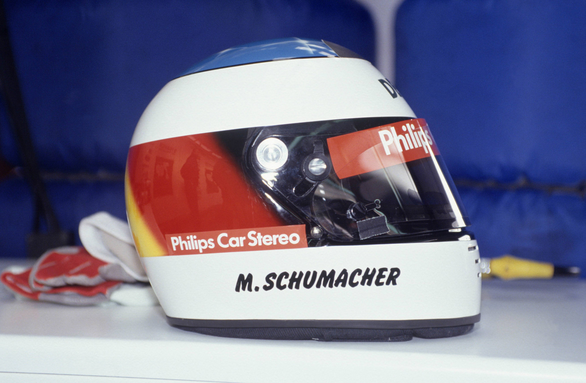 White helmet in German flag colours; ‘M Schumacher’ on side