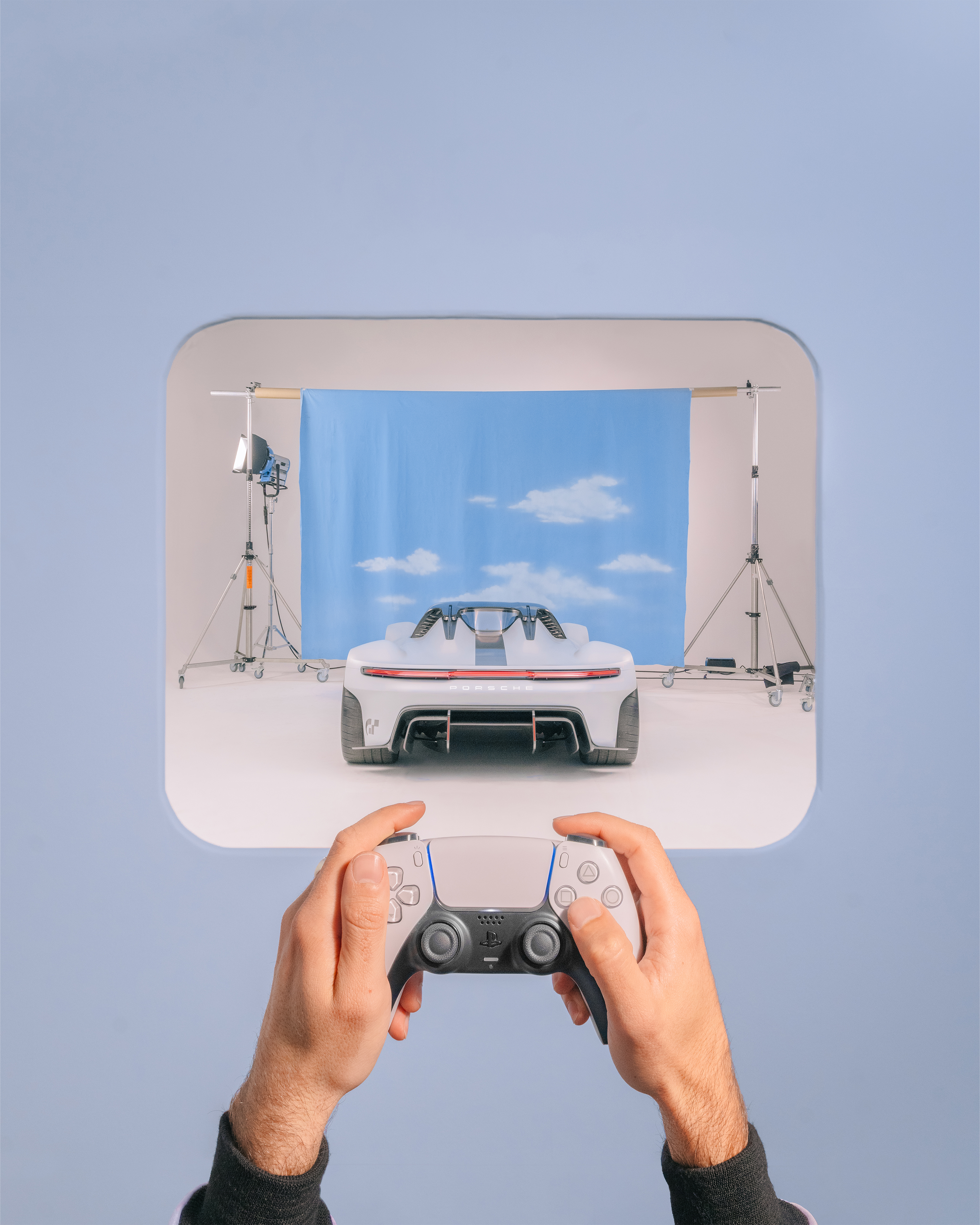 Man with PS5 controller, Porsche Vision Gran Turismo in view