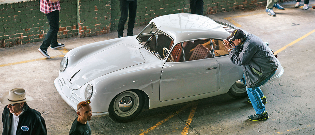 Light grey Porsche 356 at event, being photographed