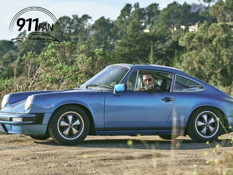 Minerva Blue classic Porsche 911 with woodland behind