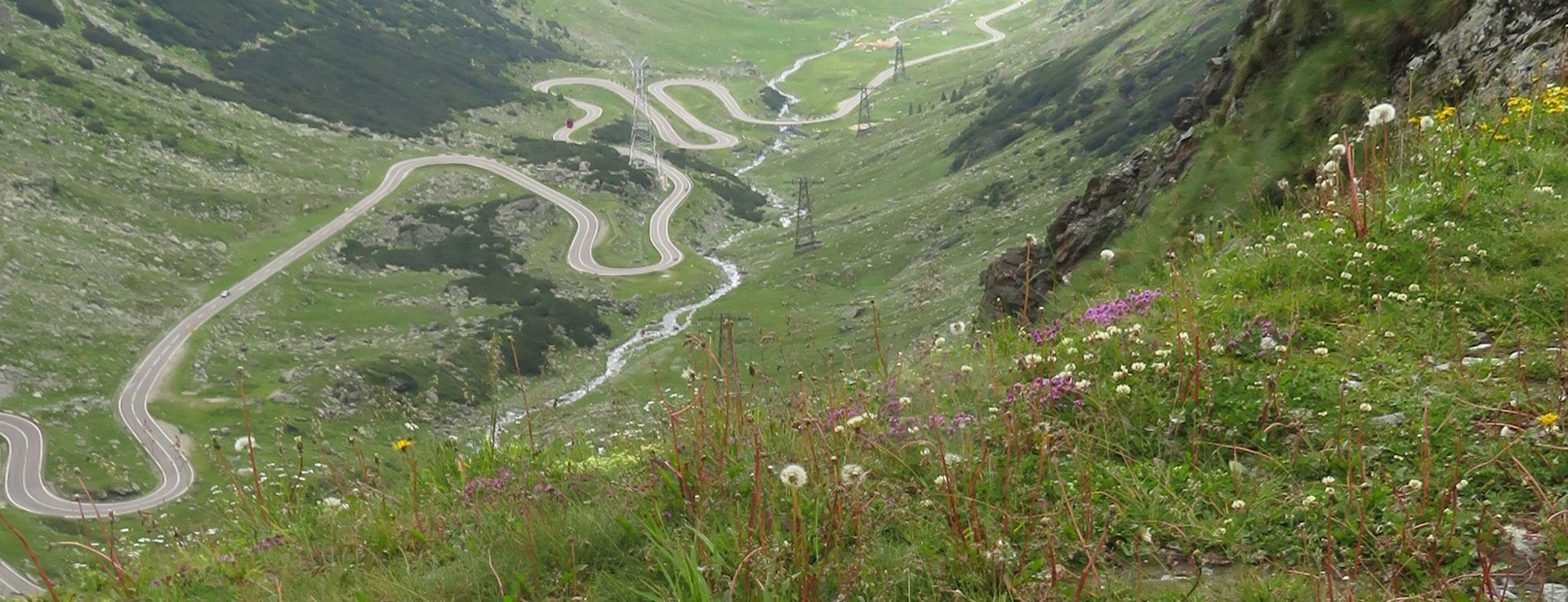 View of twisting Transfăgărășan highway from above with Porsche 911