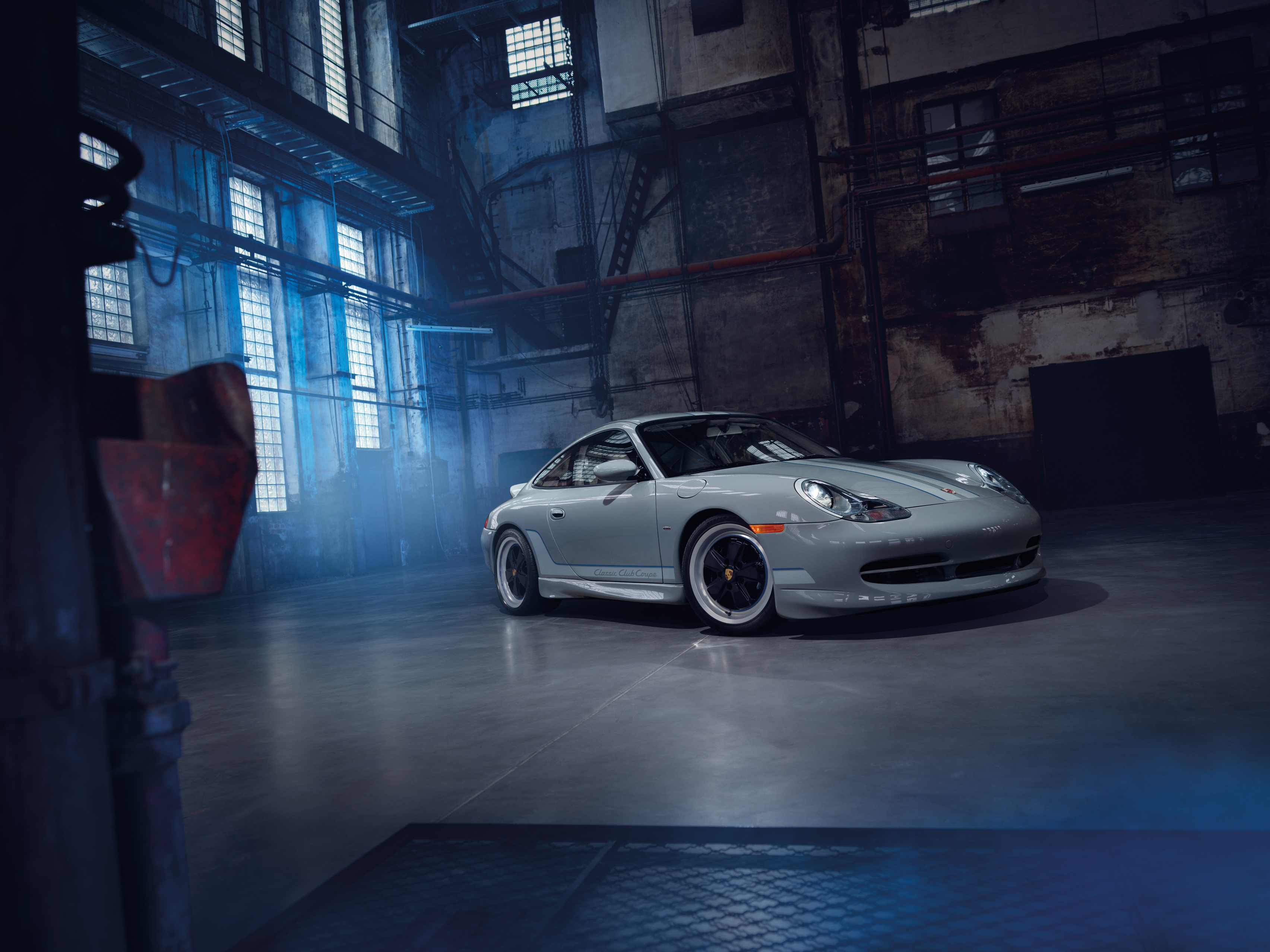 Porsche 911 Classic Club Coupe in dark, industrial warehouse