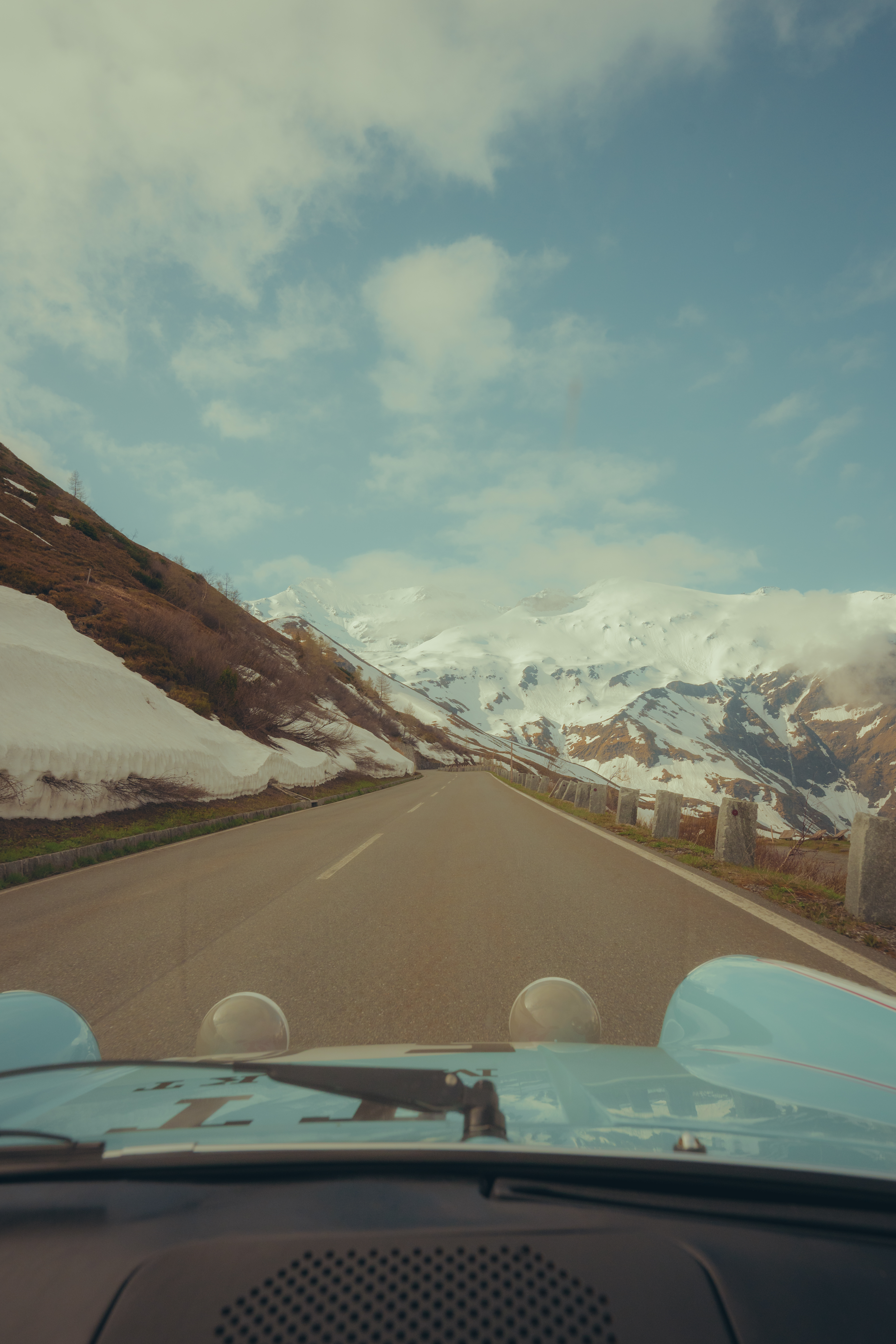View out of Porsche 911 onto road of Grossglockner Pass, Austria