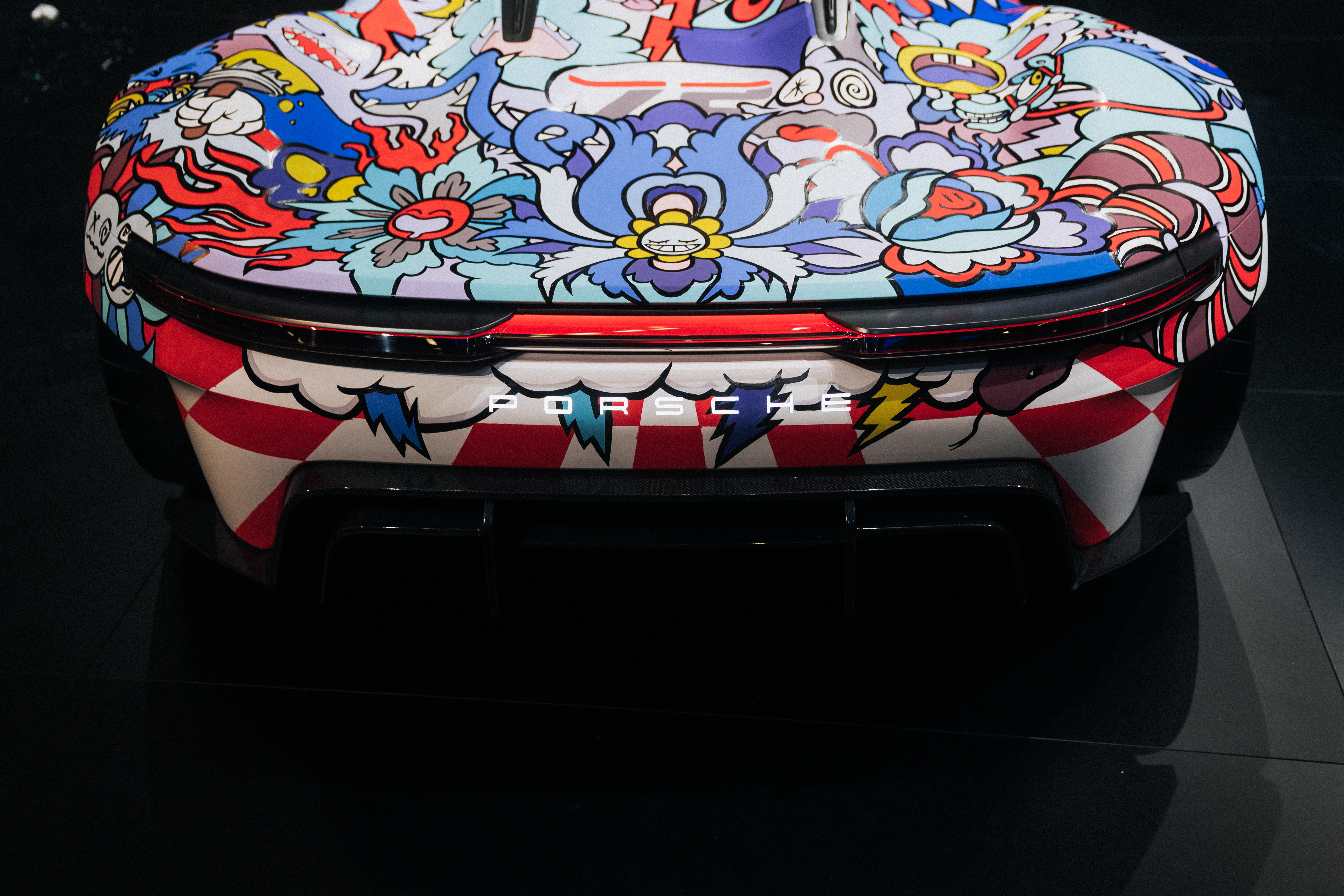 Rear view of Porsche Vision GT covered in bold cartoons
