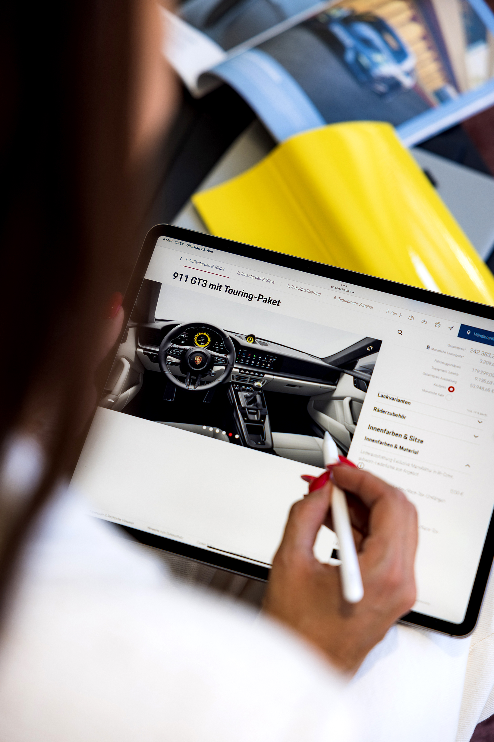 Woman uses iPad and Apple pencil on Porsche Car Configurator