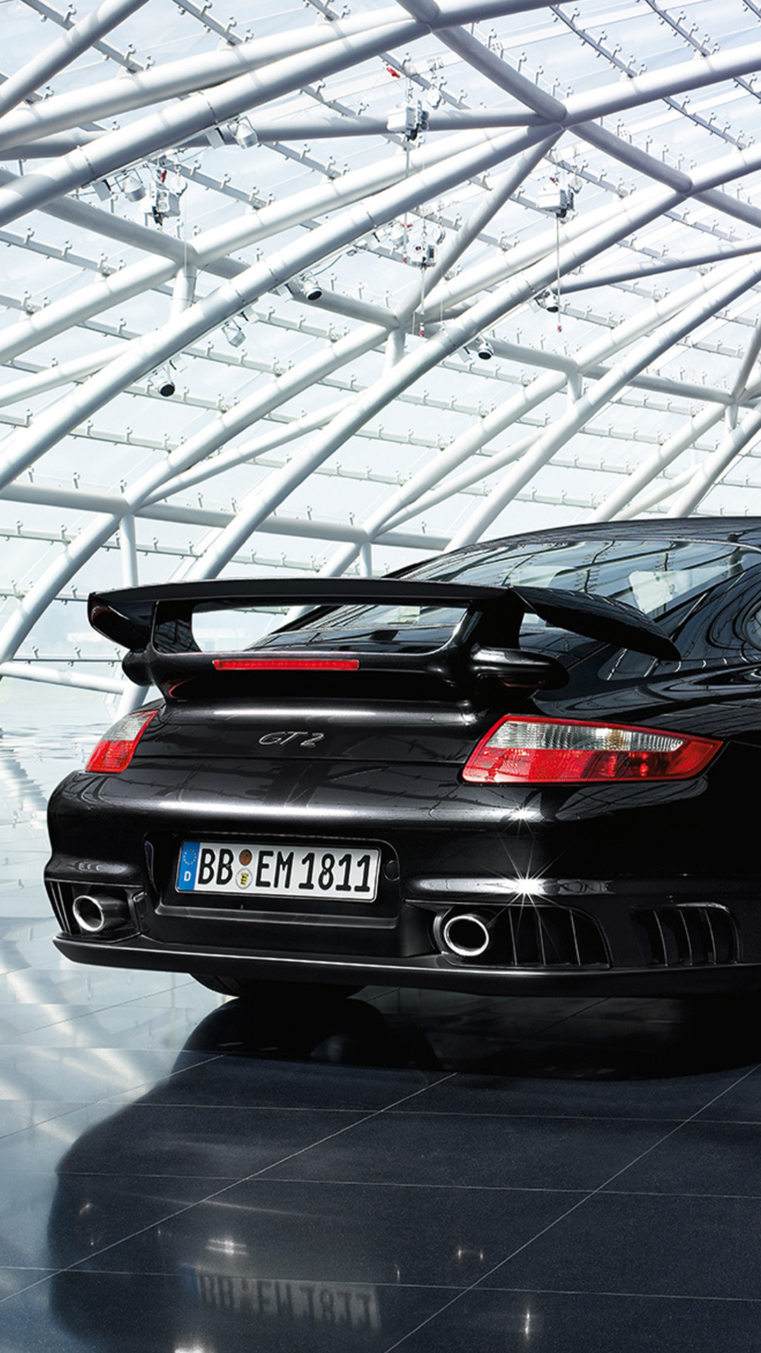 Rear view of Porsche 911 GT2 type 997 black inside glass storage space_mobile