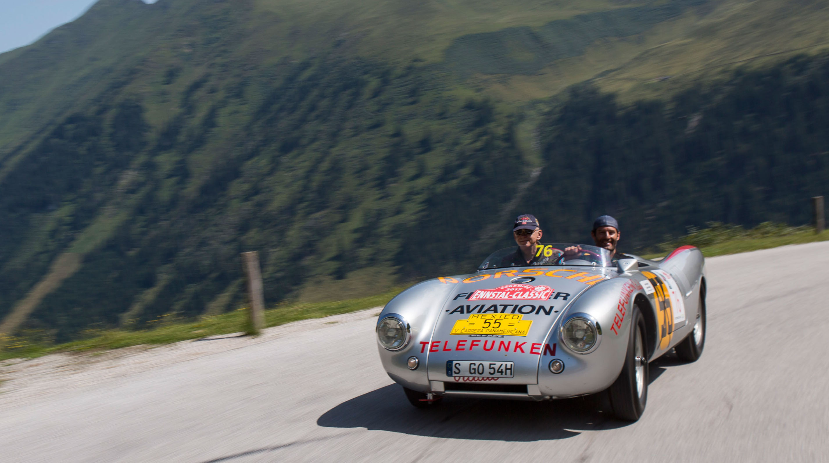 Silver Porsche 550 Spyder with original racing livery on road