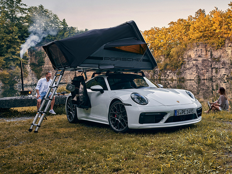 A Porsche with a roof tent in a beautiful landscape
