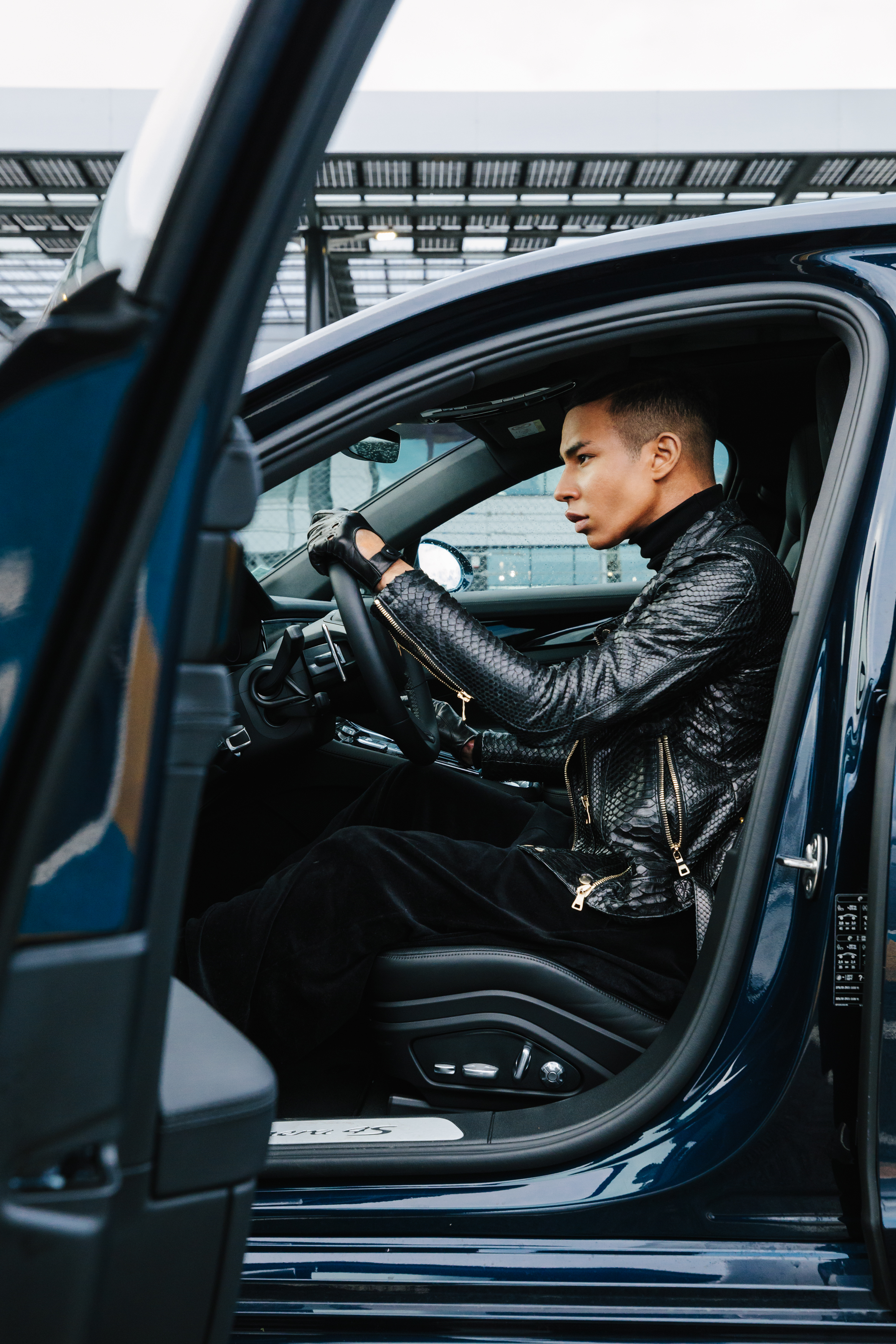 Olivier Rousteing behind the wheel of a Porsche Panamera