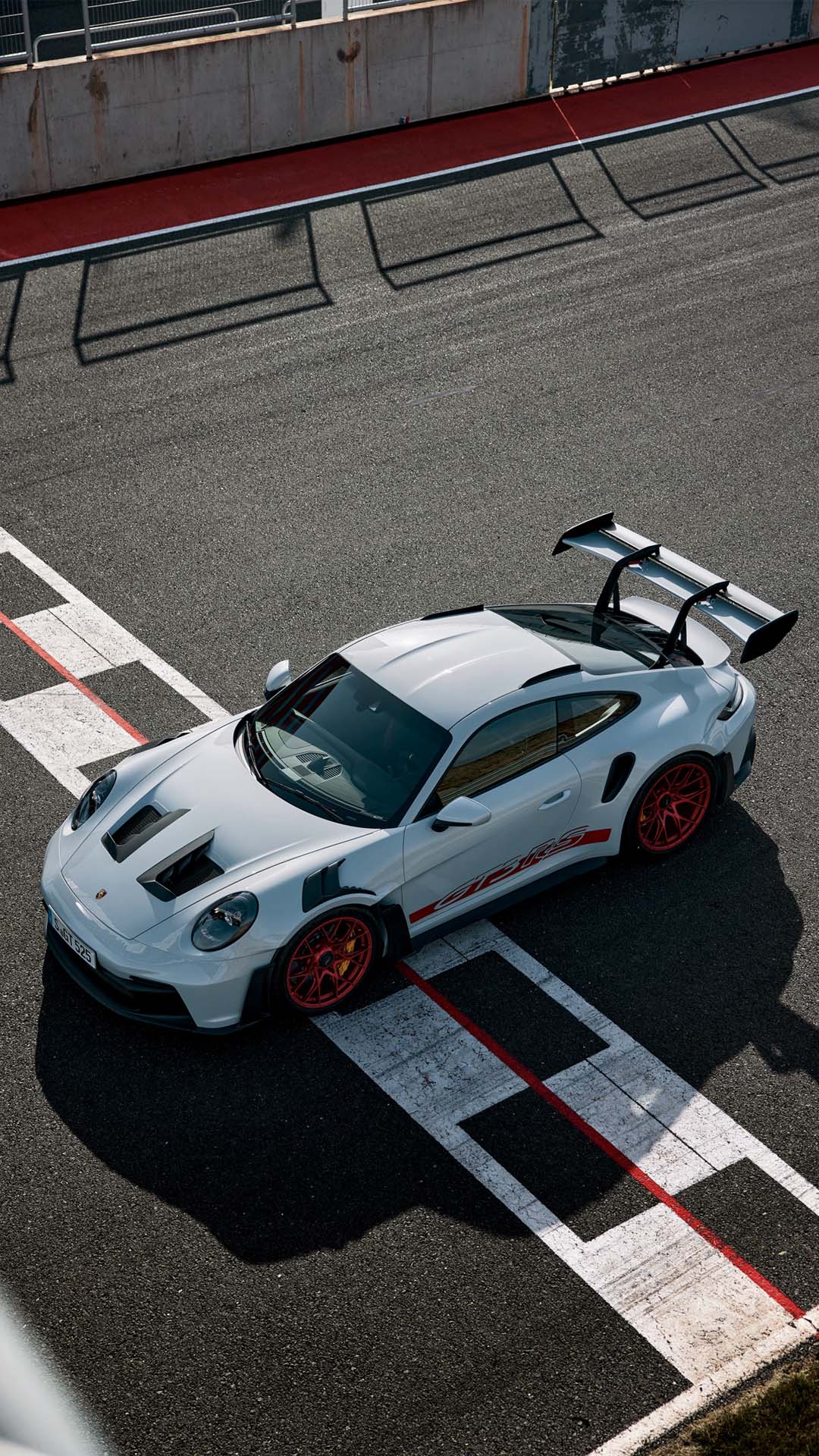 Porsche 911 GT3 RS wallpaper carparked on racetrack mobile 1