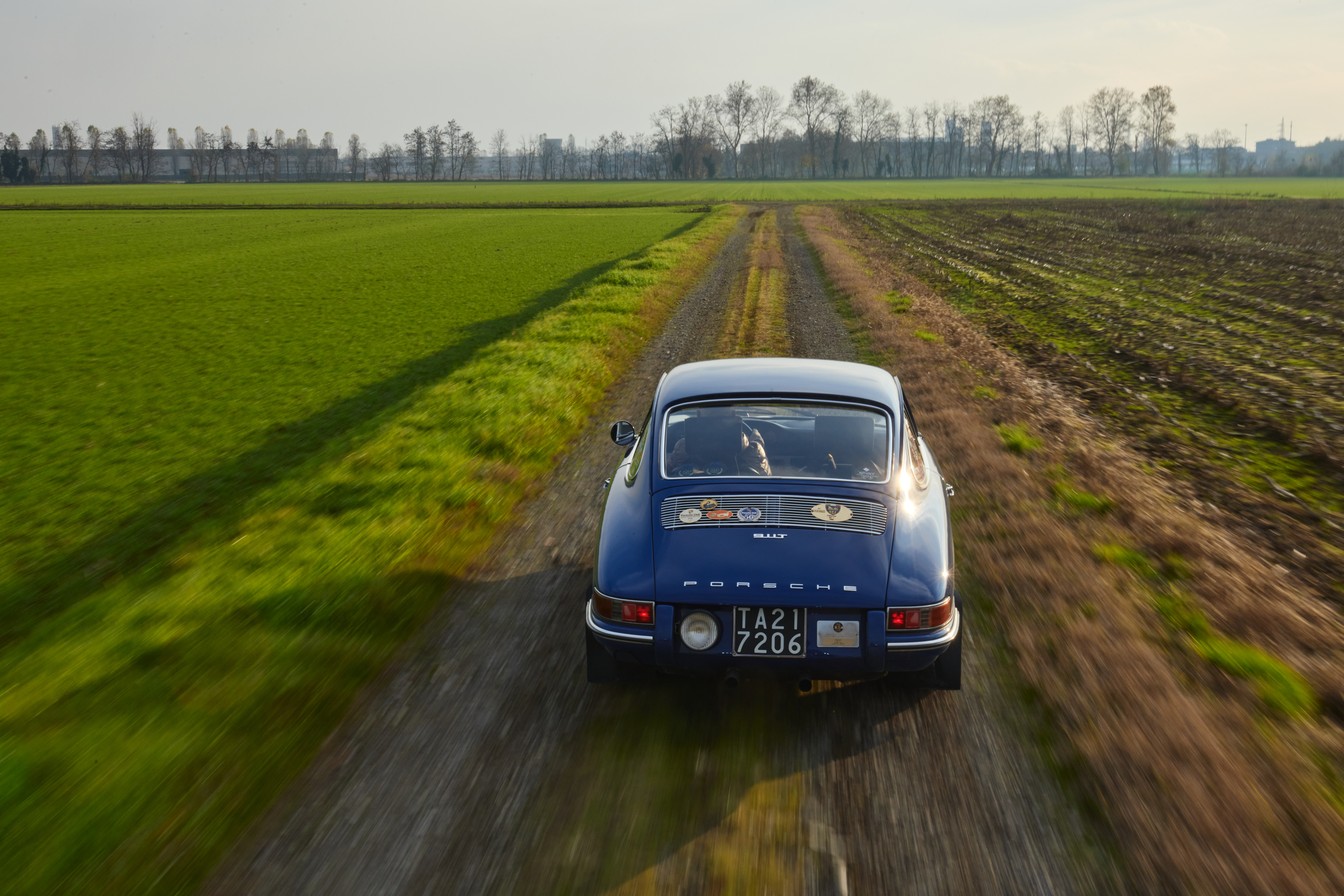 Rear view of classic Porsche 911 T on country road