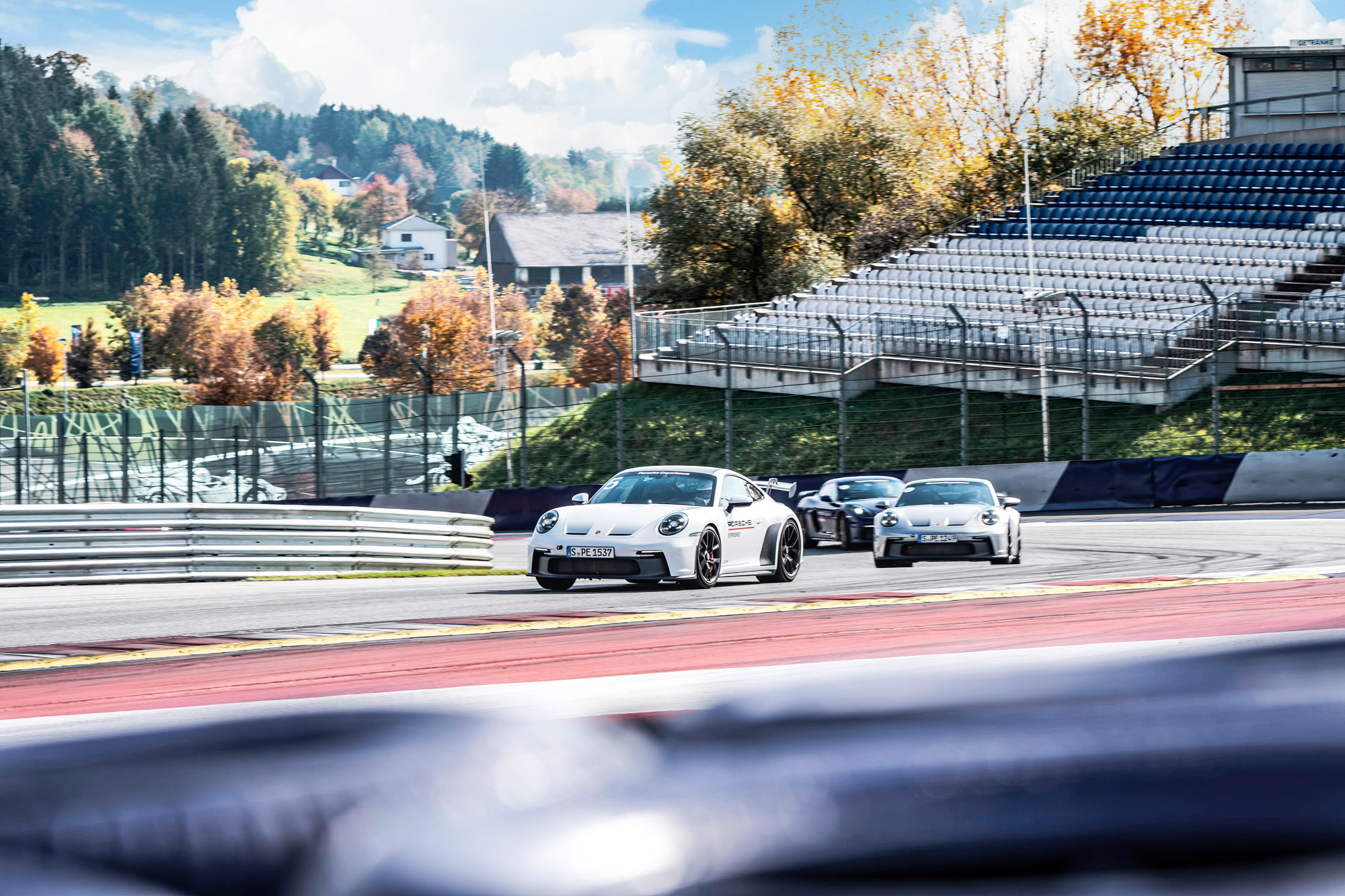 Porsche cars on the circuit at a Porsche Track Experience