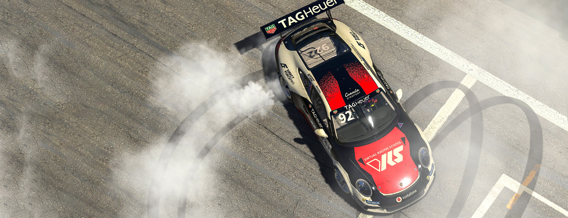 Porsche TAG Heuer Supercup car doing doughnuts on the track