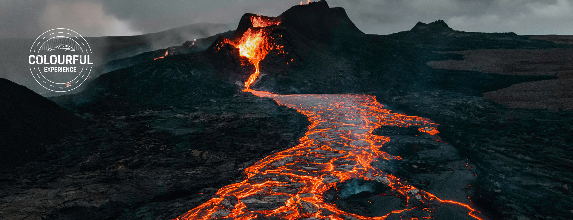 River of orange lava flows down from Mount Etna, Sicily
