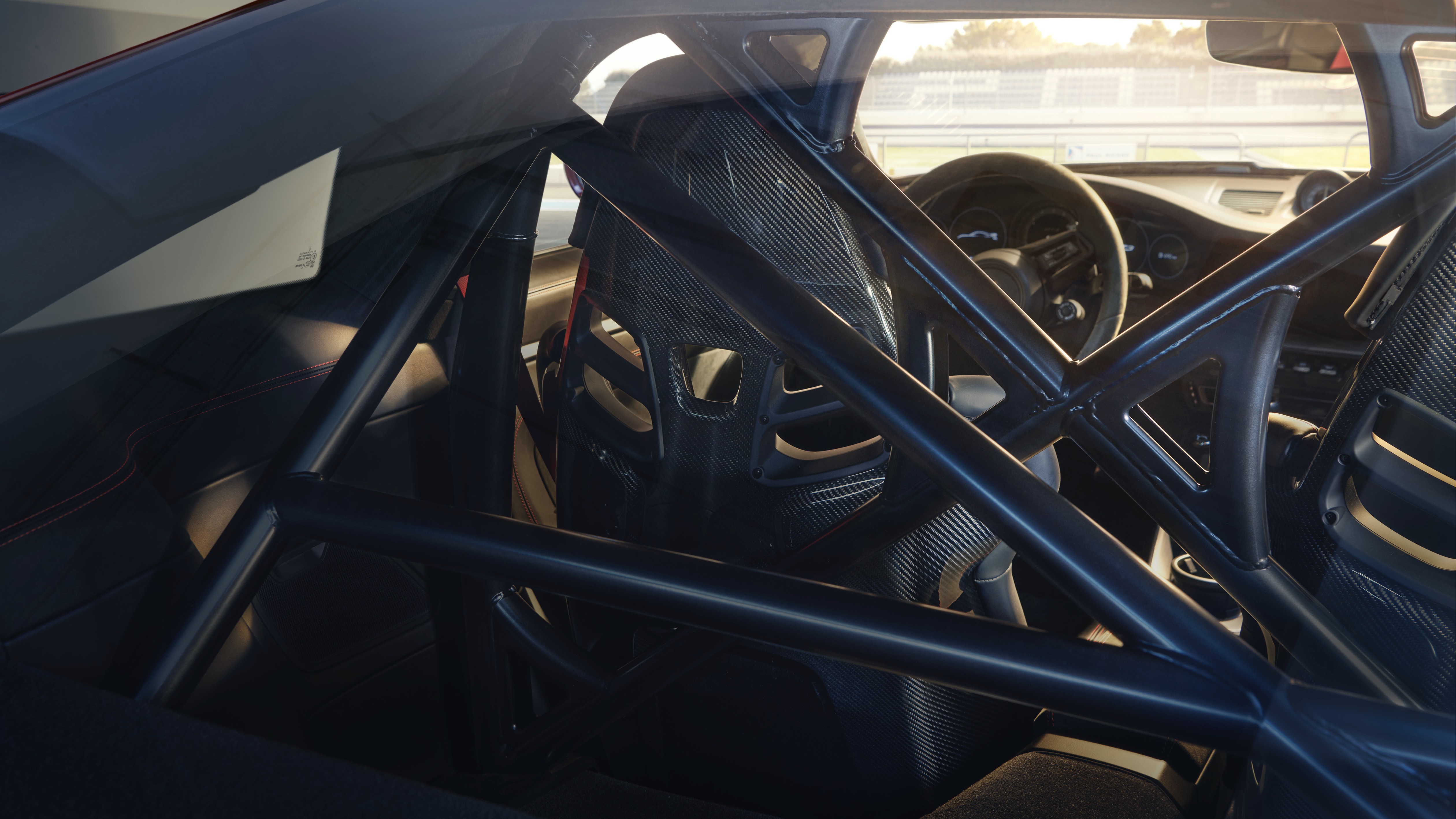 View of interior showing carbon fibre seats and rear struts