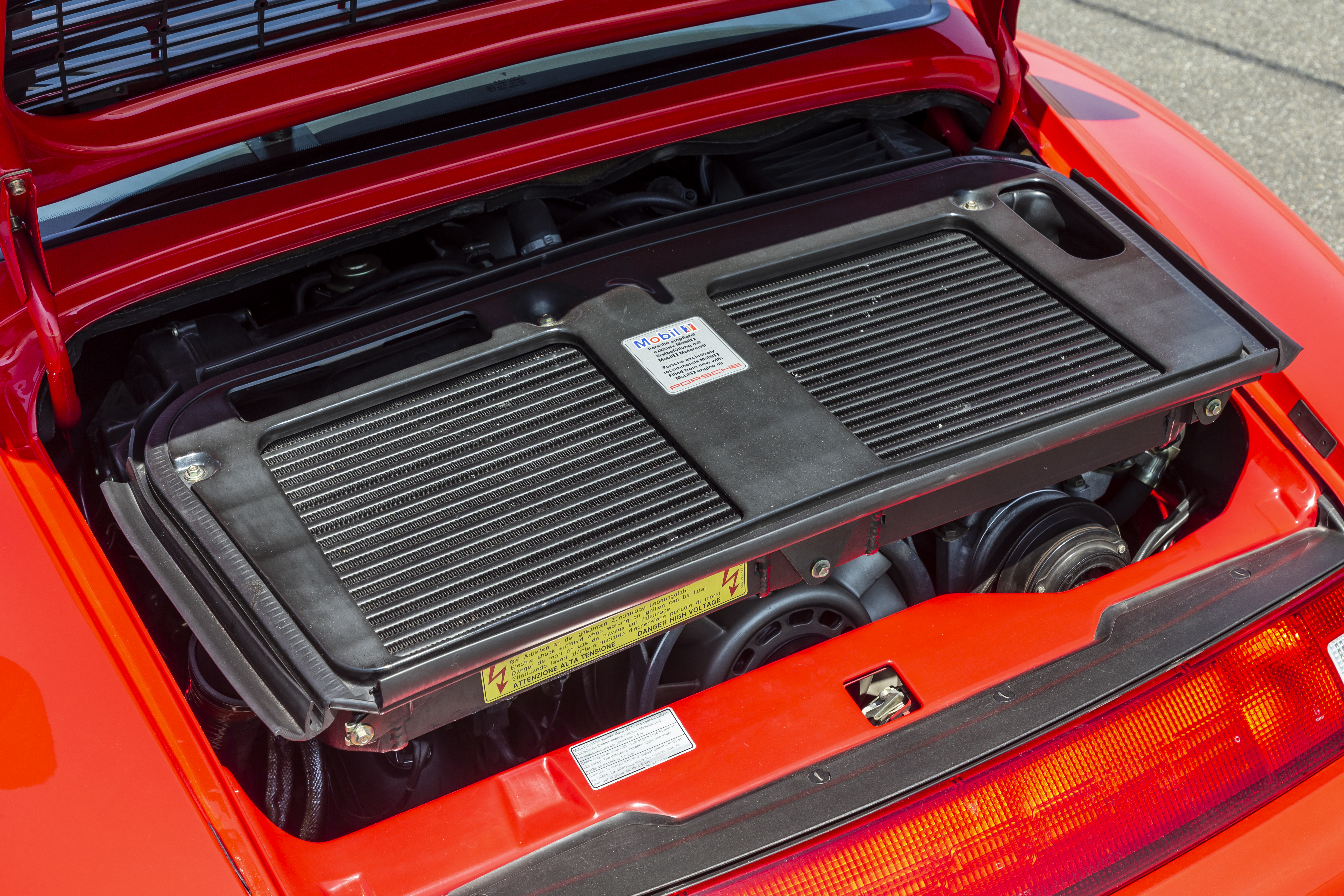 Engine compartment of a red Porsche 911 Turbo (type 993)
