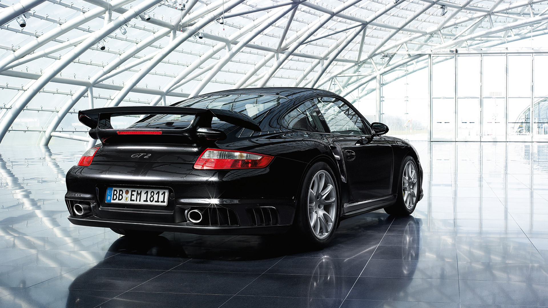 Rear view of Porsche 911 GT2 type 997 black inside glass storage space_desktop