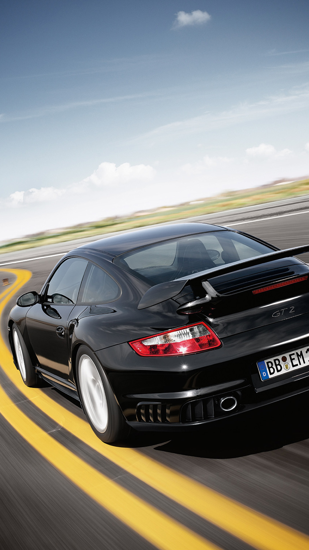 Rear view of Porsche 911 GT2 type 997 black on racetrack_mobile