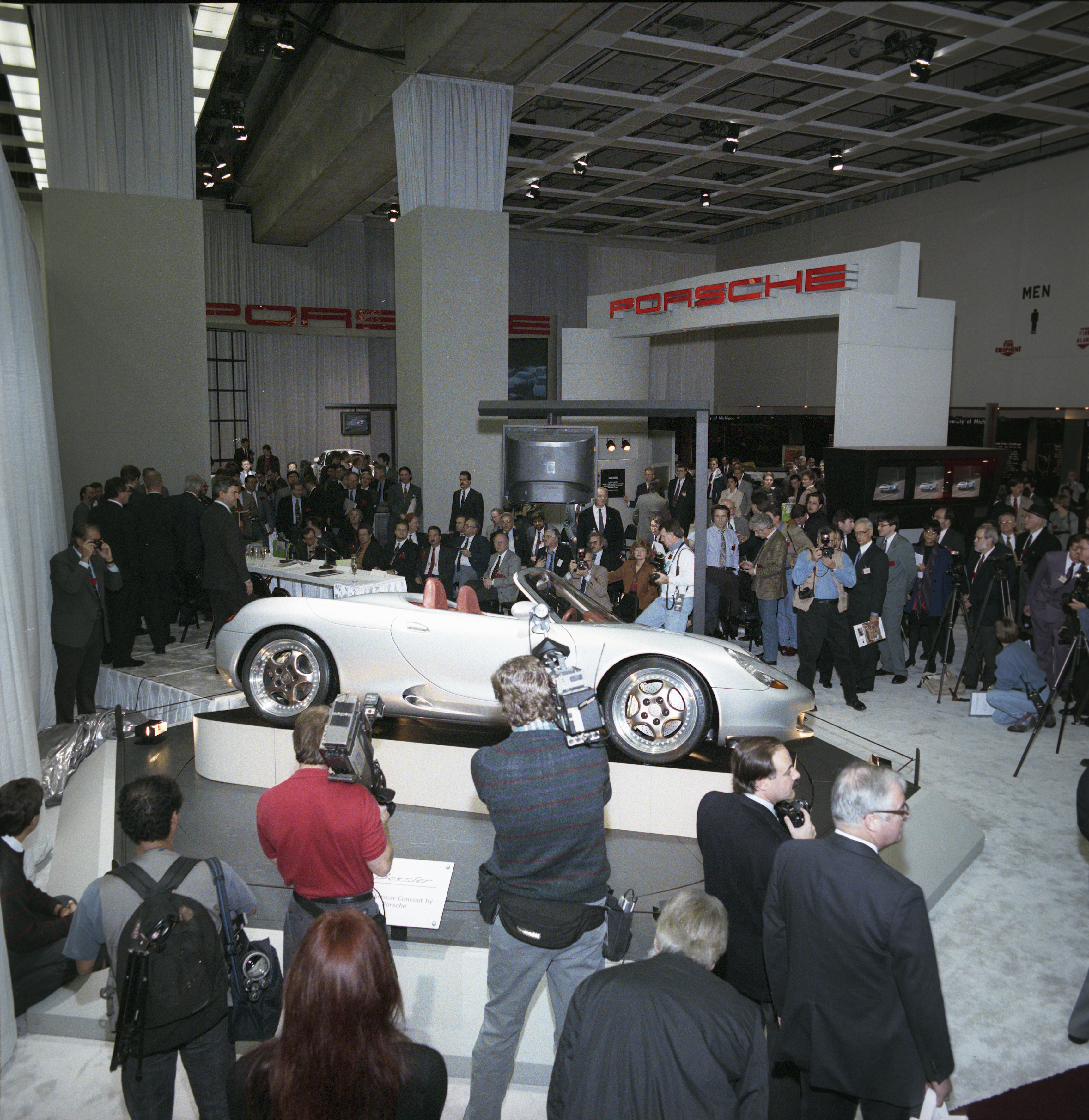 Journalists and TV cameras surround Boxster concept on show stand