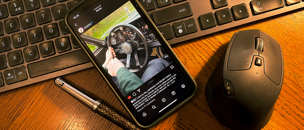 iPhone showing Porsche Instagram page on desktop