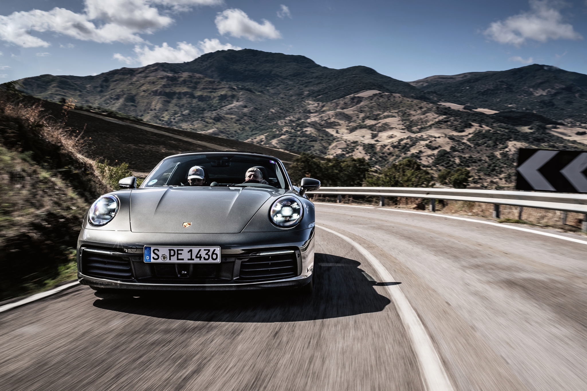 Silver Porsche 911 Targa 4S on road in Sicily