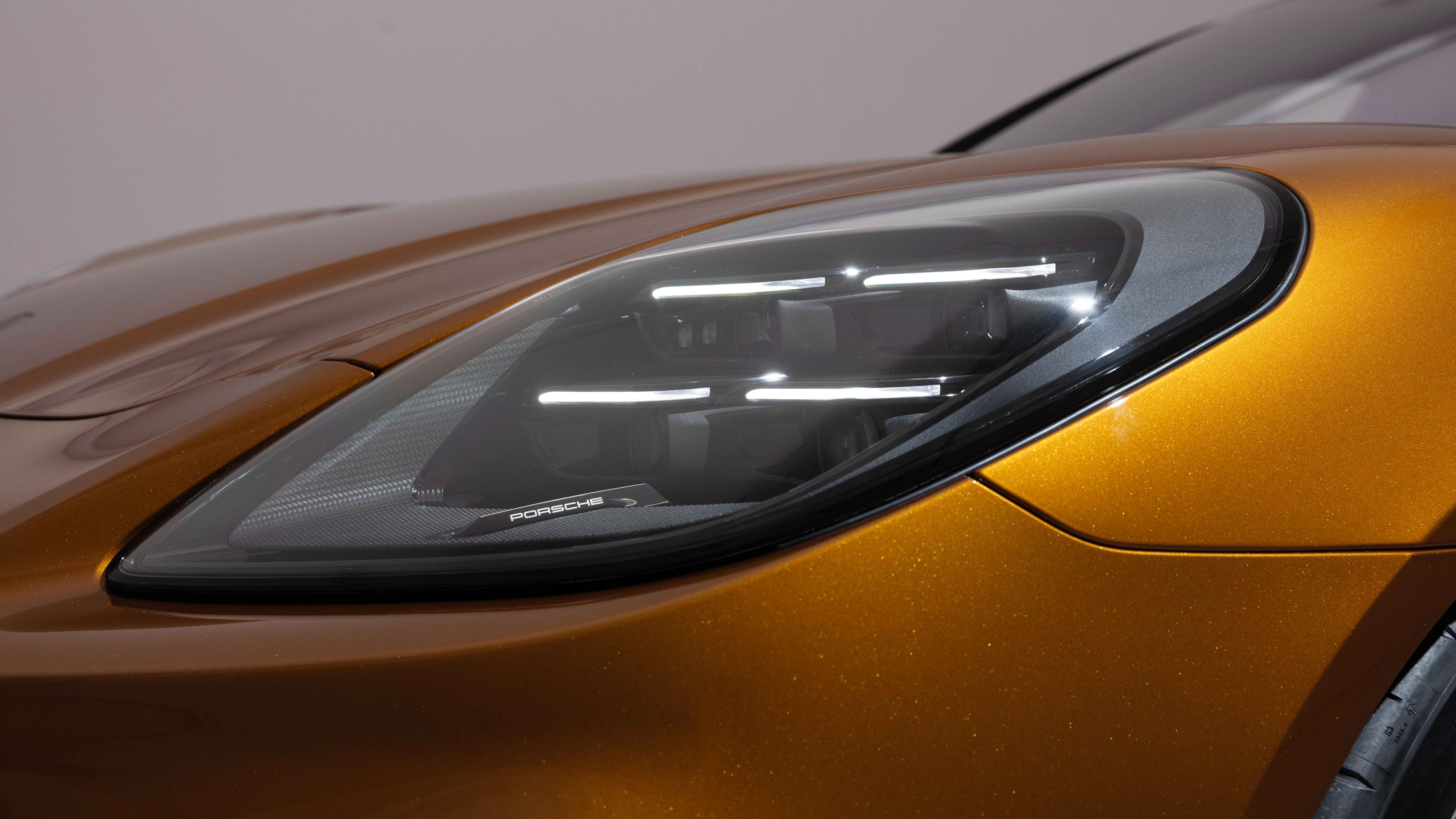 Close-up of left front headlight of Porsche Panamera Turbo E-Hybrid
