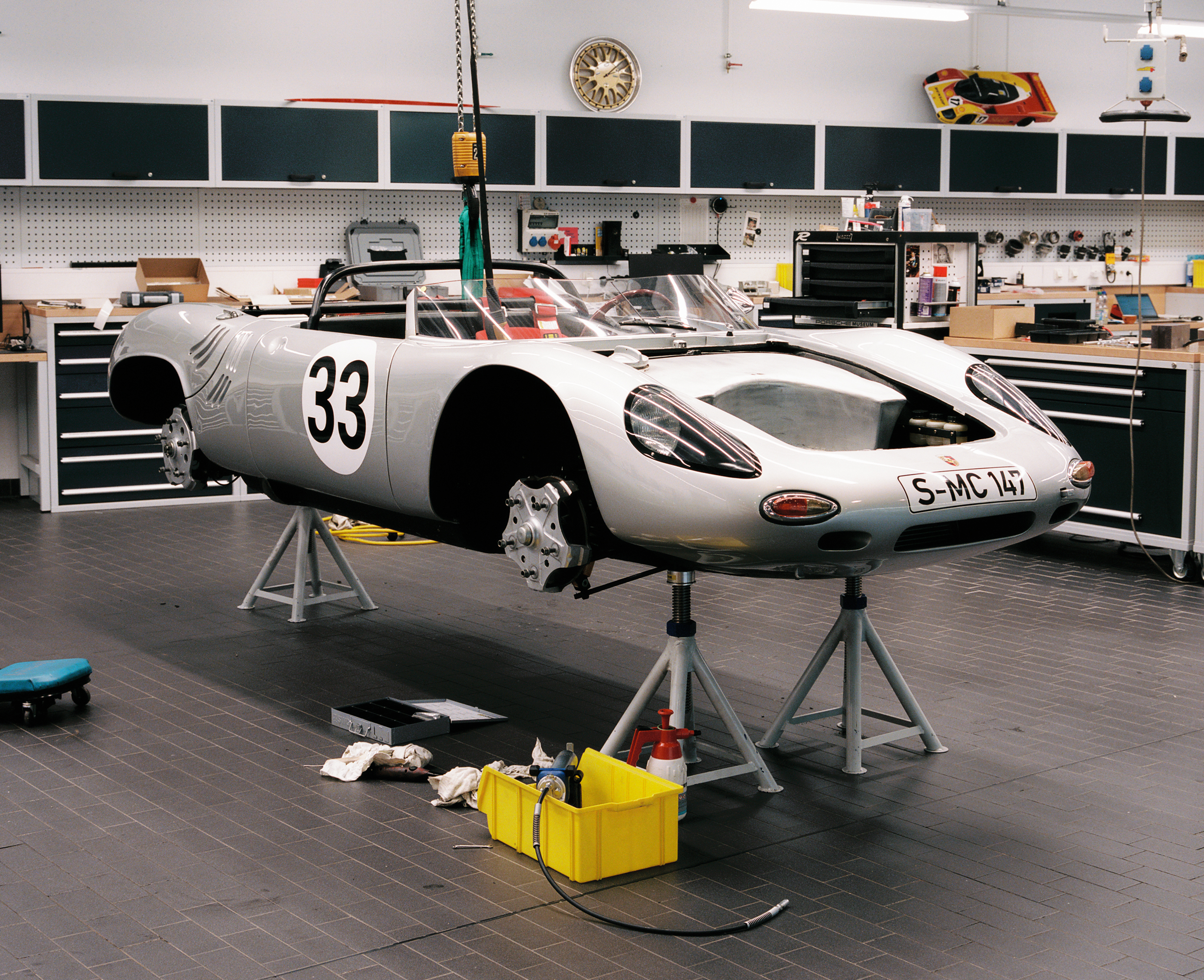 Porsche 718 W-RS Spyder undergoing maintenance at Porsche Museum workshop