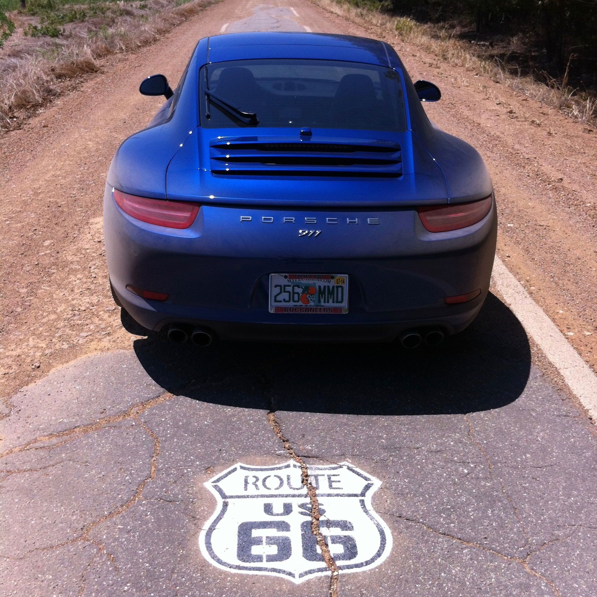 Rear of blue Porsche 911 991 on Route 66
