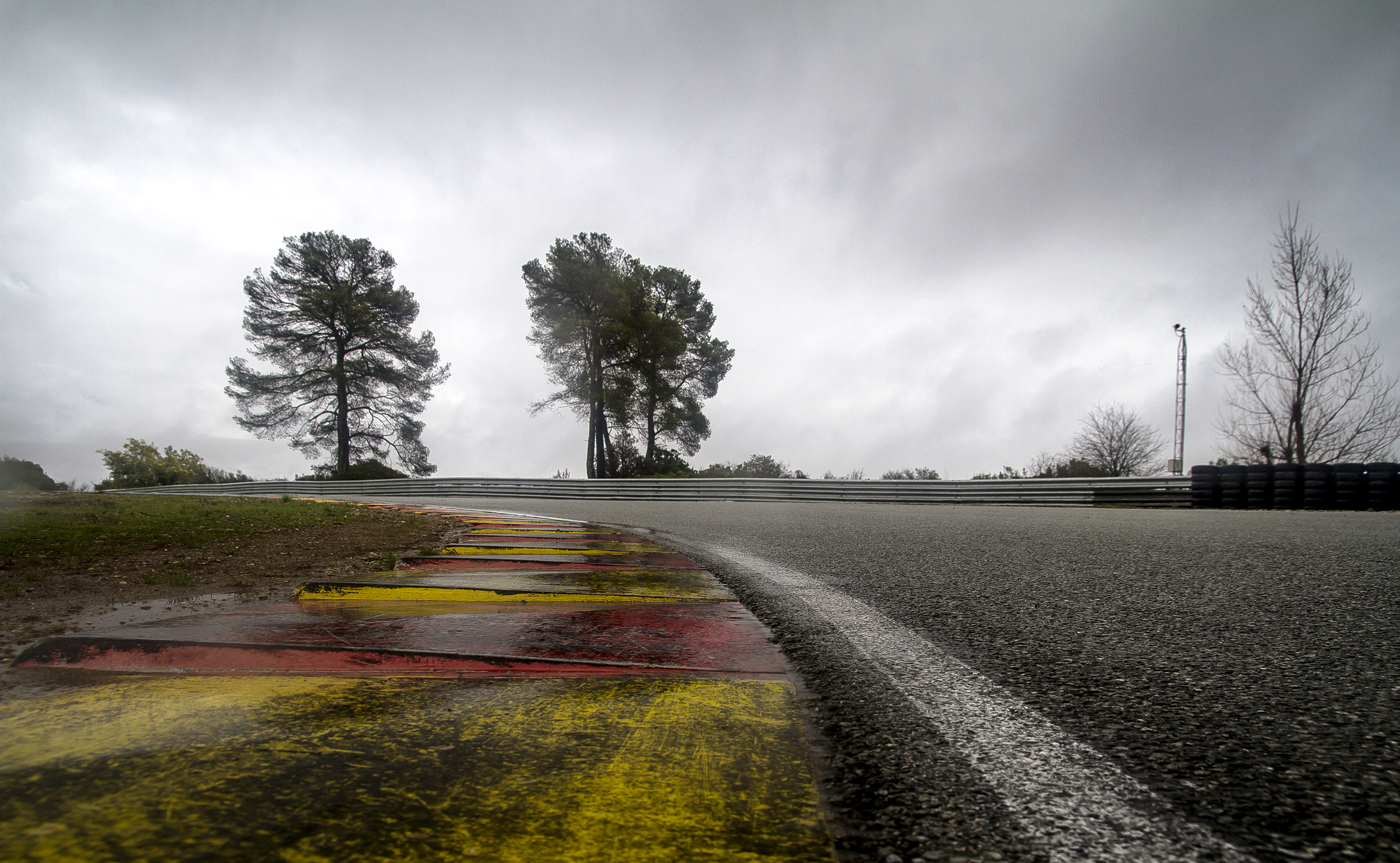Apex of a race track on grey, wet day