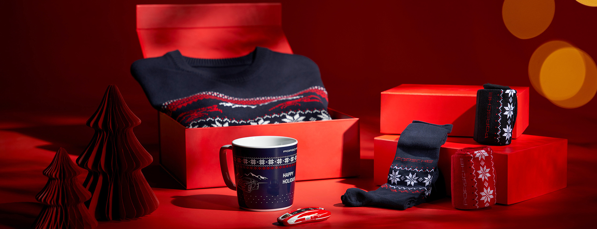 Porsche gifts including socks, mug, car keys and Porsche Christmas jumper